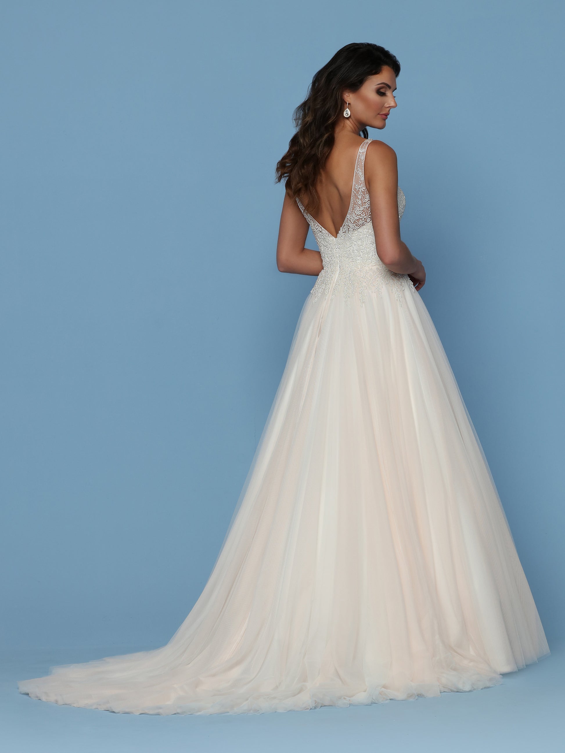 Davinci Bridal 50544 is a Beautiful Lush Soft Tulle A Line Ball Gown with a Hand Embellished Bodice cascading into to tulle skirt. Sweetheart Neckline with a sheer Illusion V Neck and straps leading around to an open V back.  Available for 1-2 Week Delivery!!!  Available Sizes: 2,4,6,8,10,12,14,16,18,20  Available Colors: Ivory/Blush, Ivory/Ivory