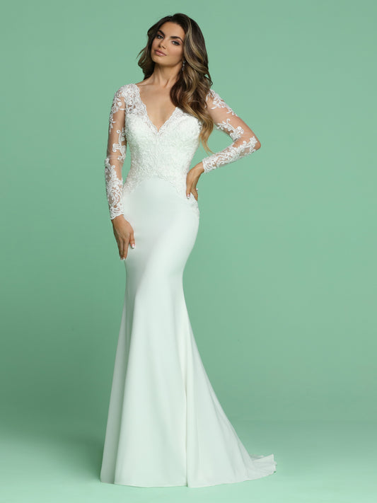 Davinci Bridal 50610 is a Beautiful Embellished Lace Sheer Long Sleeve Bridal Gown Featuring a V neckline with a Crystal & Beaded Fitted Lace Bodice and open V back with buttons running down the hips. Crepe Skirt flowing into a sweeping train.   Available for 1-2 Week Delivery!!!  Available Sizes: 2,4,6,8,10,12,14,16,18,20  Available Colors: Ivory  Available Sizes: 2-30