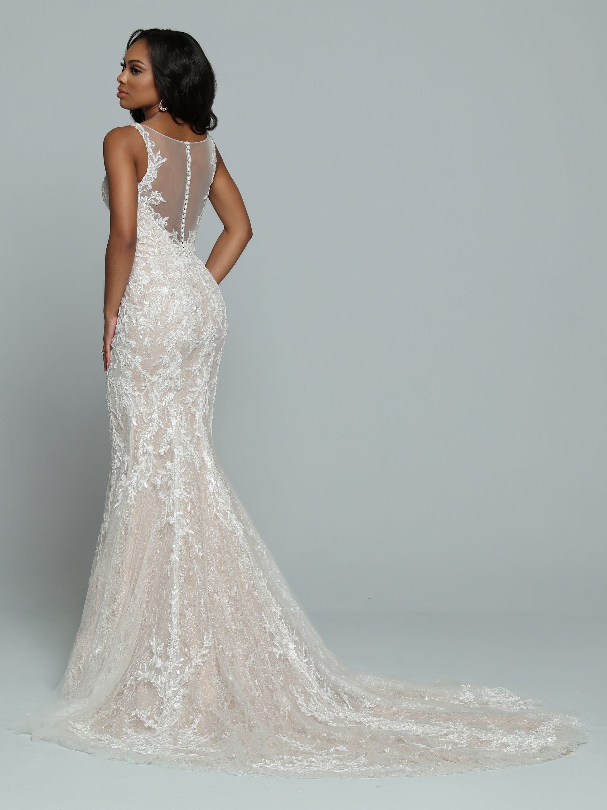 Davinci Bridal 50678 Fitted Beaded Lace Mermaid Wedding Dress Sheer Bridal Gown Beautiful Lace & Tulle Fit & Flare Sheath Wedding Dress features a Deep V-Neckline with Sheer Modesty Panel. Beaded Lace Applique Covers the Bodice & frames the Sheer Back with its Covered Button Accent. Delicate Trails of Beaded Applique flow Below the Hip & Sweep Up from the Chapel Length Train. Sequin Accents Sparkle from Bodice to Hem.