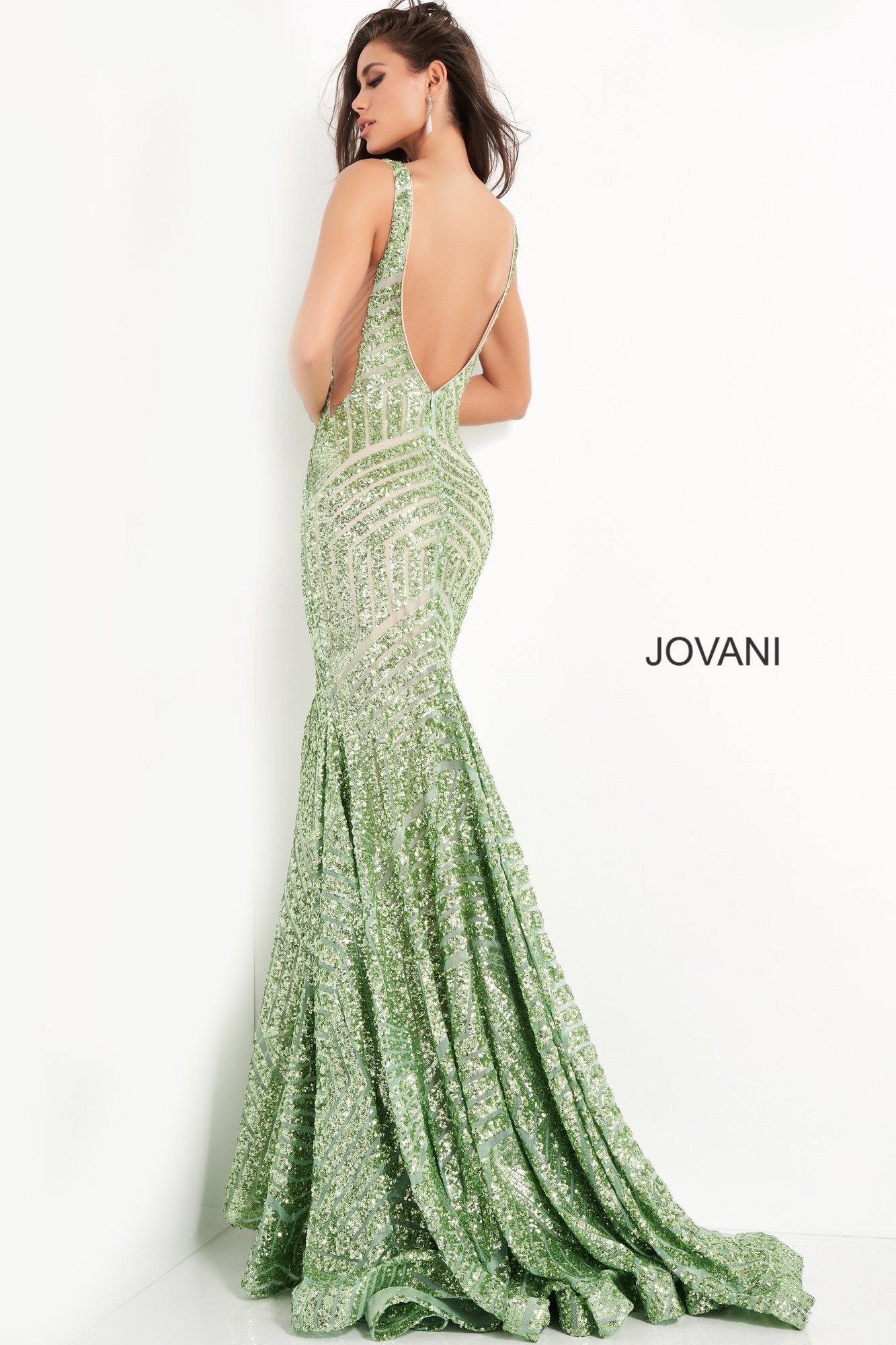 Long Jovani 59762 Prom Dress, Featuring a plunging neckline & A Fully sequined Fitted Mermaid Bodice. This Open V Back Pageant Gown & prom dress is perfect for the stage is has a lush trumpet sequin embellished skirt and sweeping train. 