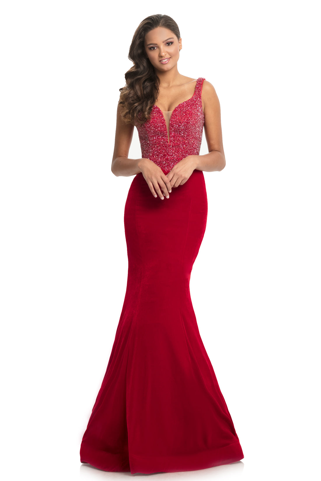 Johnathan Kayne 9019 is a velvet mermaid Prom Dress Pageant Gown & Formal Evening Wear. Long fitted mermaid silhouette with a basque waistline. Fully Embellished bodice is covered in crystal studs and beading. Plunging neckline with mesh insert.