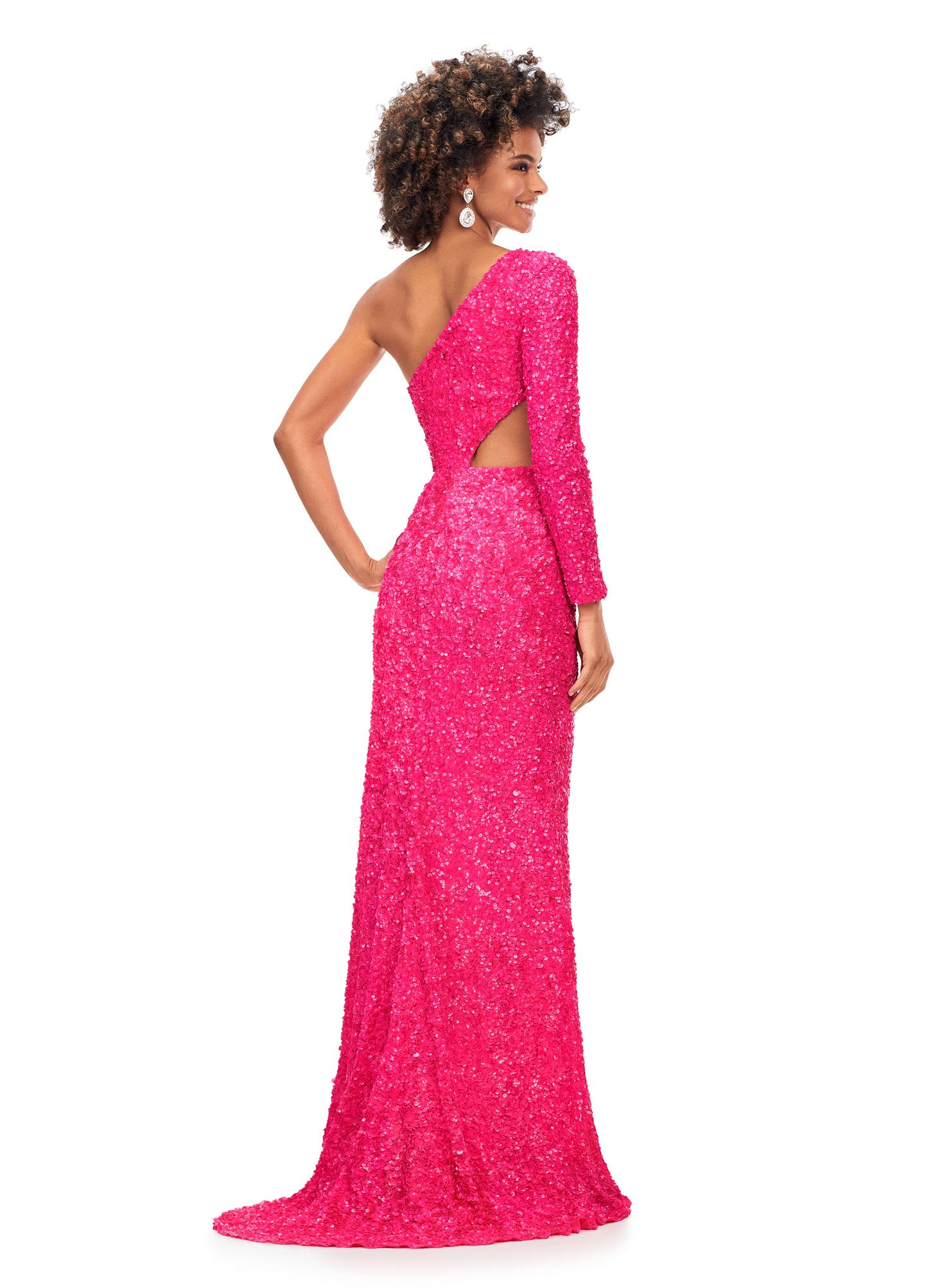 Ashley Lauren 11340 This sequin one shoulder gown features one sleeve and a shark bite cut out. The gown is complete with a left leg slit.