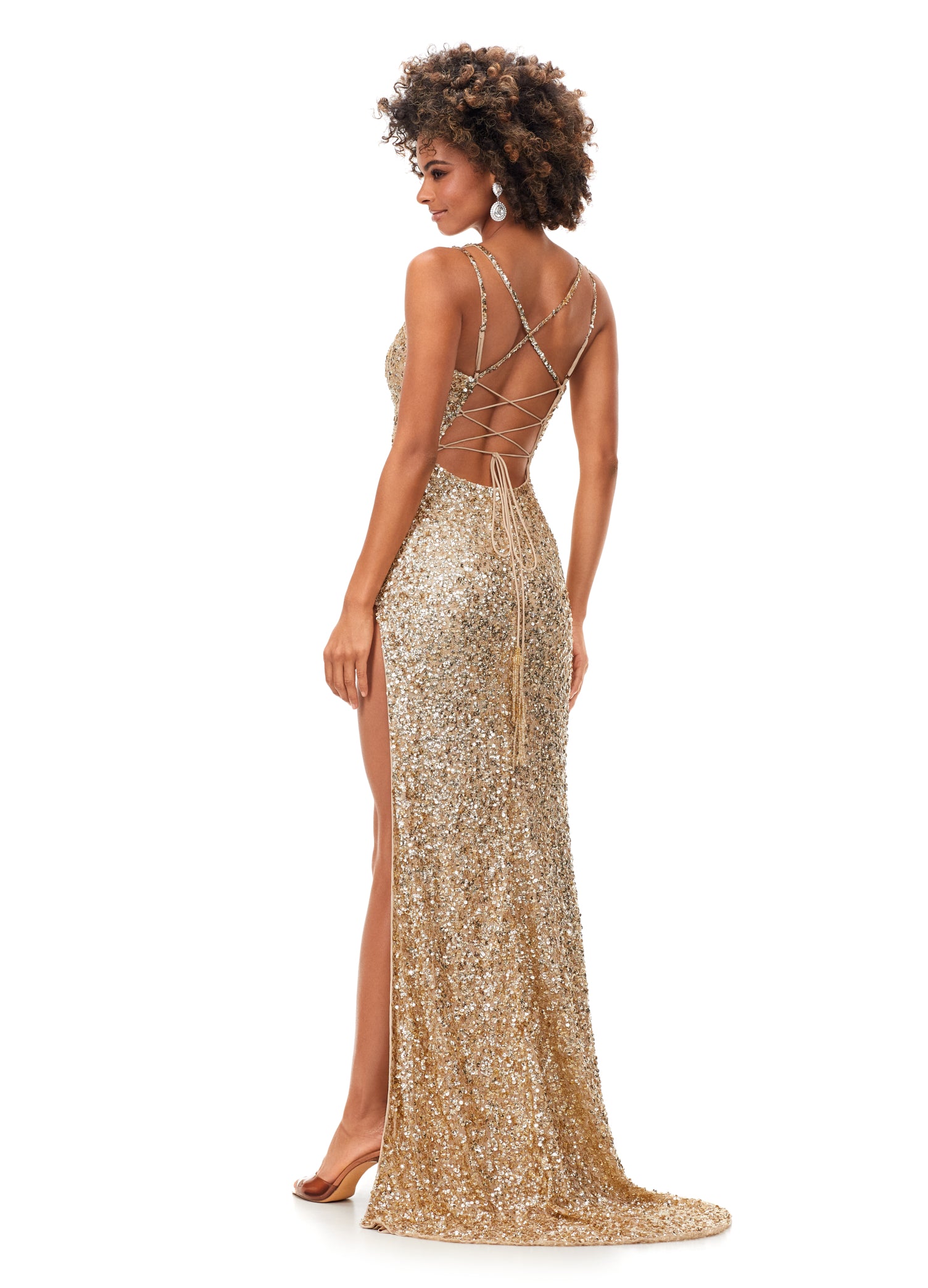 Ashley Lauren 11342 Sequin Spaghetti Strap Prom Dress with Lace Up Back  This sequin gown features double spaghetti straps and a sweetheart neckline. The gown is accented with a left leg slit and a lace up back complete with beaded fringe tassels.