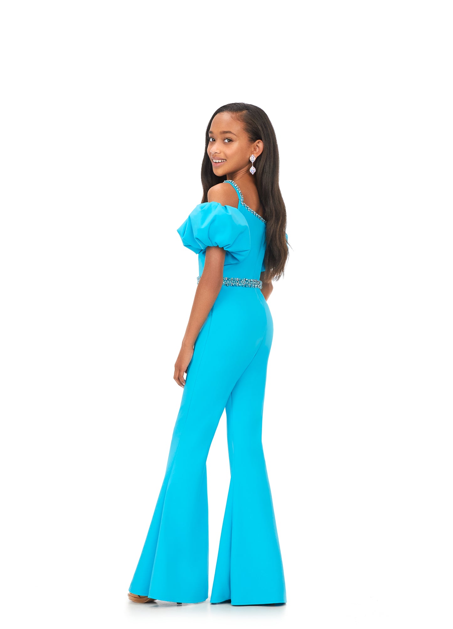 Ashley Lauren Kids 8164 Girls Off Shoulder Scuba Jumpsuit with Puff Sleeves  A scuba jumpsuit with off shoulder puff sleeves? We're obsessed! This jumpsuit has a beaded neckline and waist band to offer the right mix of classy and fabulous.