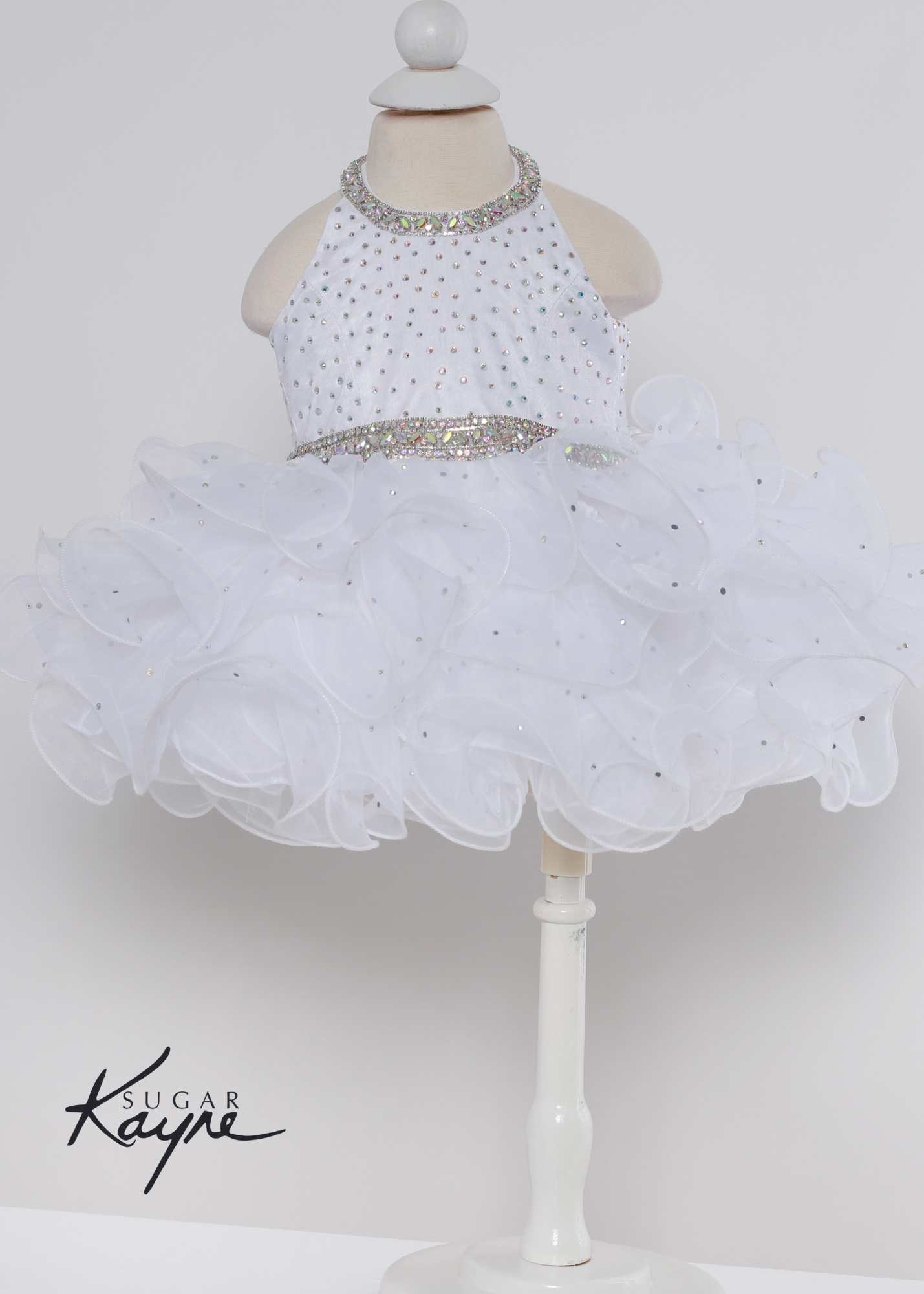 Sugar Kayne C220 Girls Baby Halter Cupcake Ruffle Pageant Dress Corset Formal Gown Have your little cupcake bring on all the charm in this stunning organza gown. The corset back is the perfect addition as the little one grows!  Colors: Bubblegum, Neon Orange, White  Sizes: 0M, 12M, 18M, 24M, 2T, 3T, 4T, 5T, 6M, 6T  Fabric Organza, Satin Lining