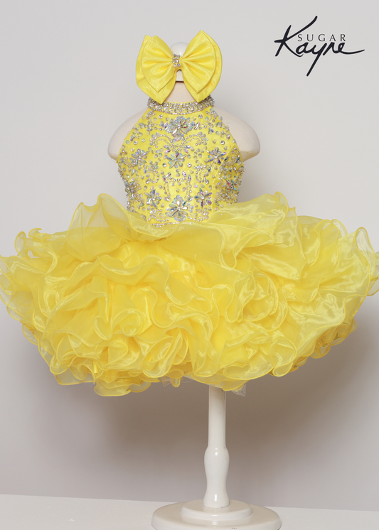 Sugar Kayne C223 Girls Baby Short ruffle Cupcake Pageant Dress Bow Halter Beaded Gown Have your little cupcake bring on all the charm in this stunning organza gown. The corset back is the perfect addition as the little one grows!  Colors: Aqua, Petal Pink, Yellow  Sizes: 0M, 12M, 18M, 24M, 2T, 3T, 4T, 5T, 6M, 6T  Fabric Organza, Satin Lining