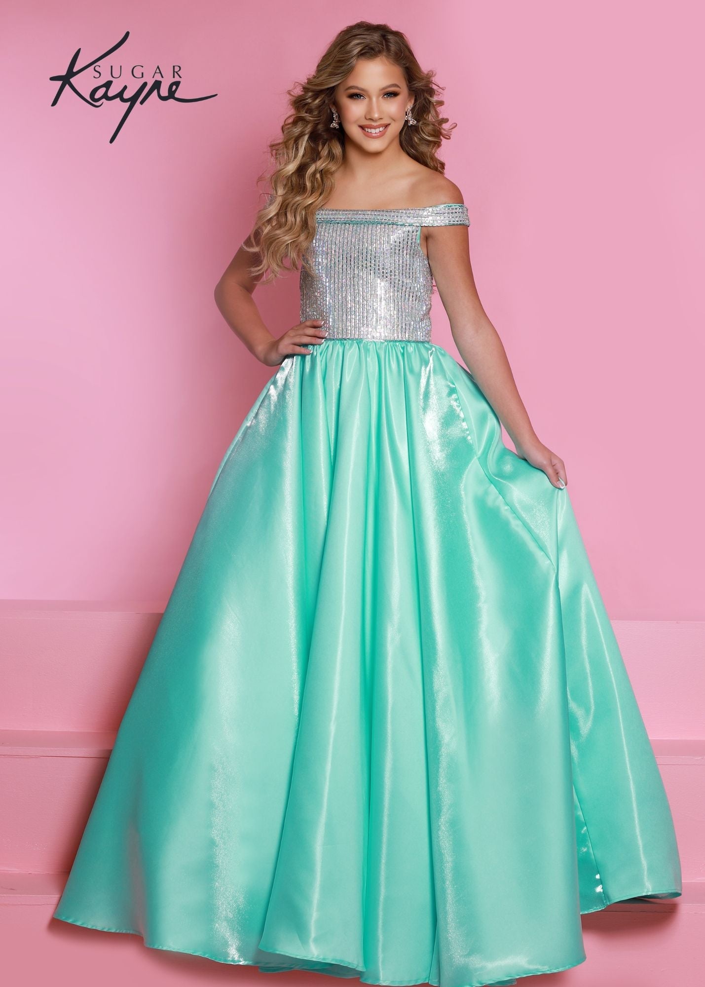 Sugar Kayne C313 Long Shimmer Satin off the shoulder Girls Pageant Dress Crystal Bodice Product Details Twinkle twinkle little star – what a princess you will be! Shine bright in this shimmer satin ballgown. The bodice is completed with fully beaded rhinestone trim and off-the-shoulder straps.  Color Aqua, Royal, Red, White  Size 2, 4, 6, 8, 10, 12, 14, 16  Fabric Shimmer Satin, Satin Lining