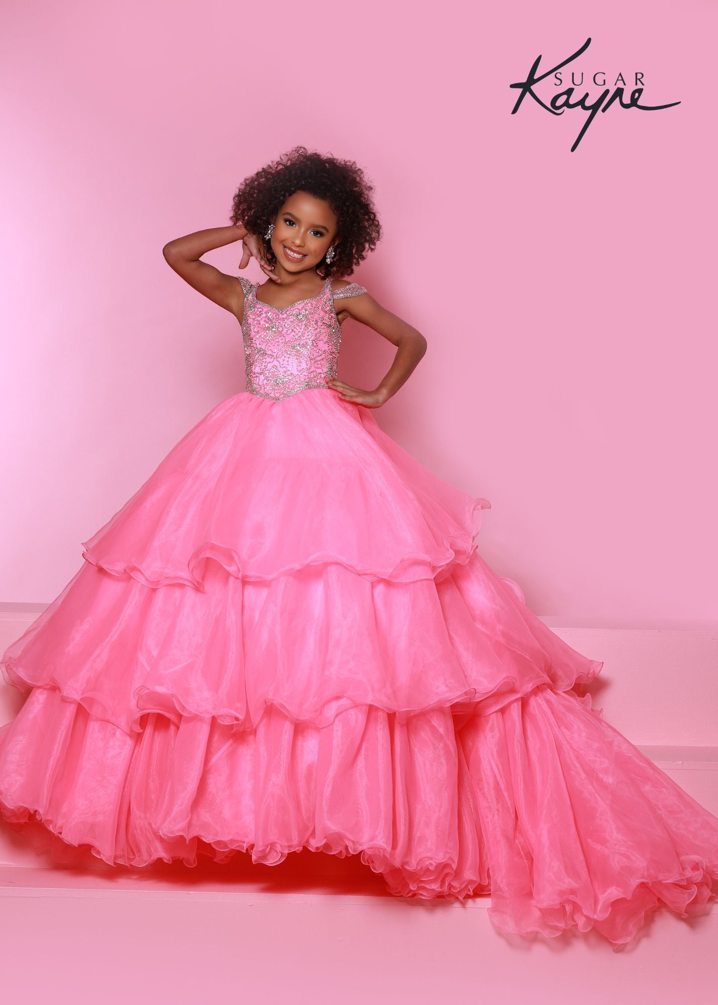 Sugar Kayne C318 Long Layer Ruffle Girls Pageant Dress off the Shoulder Ball Gown Beaded. It's all in the details! The hand-beaded bodice on this organza ballgown takes our breathe away. The off-the-shoulder straps and two keyholes in the back add all drama!  Colors: Bubblegum, Hot Coral, Periwinkle  Sizes: 2, 4, 6, 8, 10, 12, 14, 16  Fabric Organza, Satin Lining