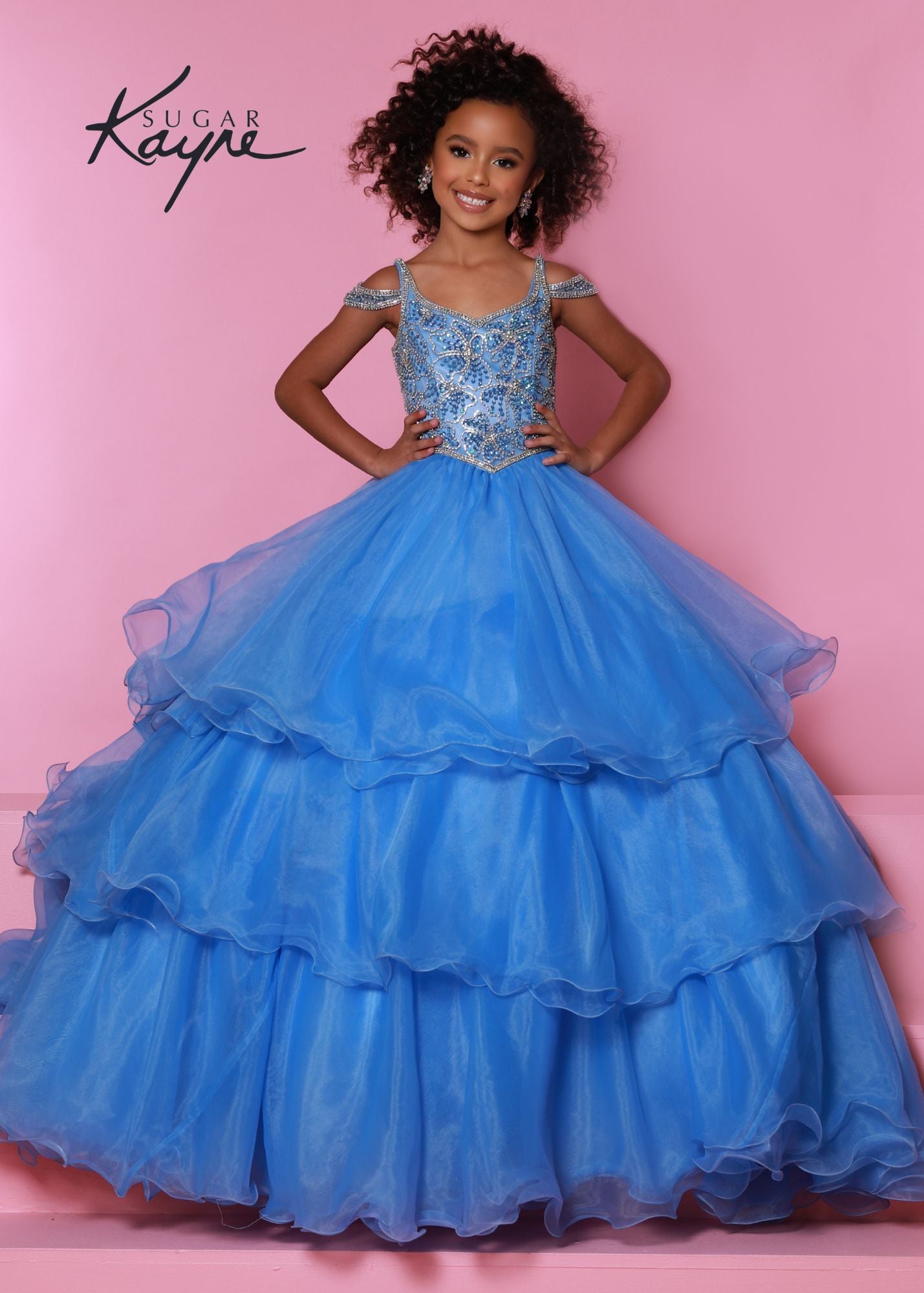 Sugar Kayne C318 Long Layer Ruffle Girls Pageant Dress off the Shoulder Ball Gown Beaded. It's all in the details! The hand-beaded bodice on this organza ballgown takes our breathe away. The off-the-shoulder straps and two keyholes in the back add all drama!  Colors: Bubblegum, Hot Coral, Periwinkle  Sizes: 2, 4, 6, 8, 10, 12, 14, 16  Fabric Organza, Satin Lining