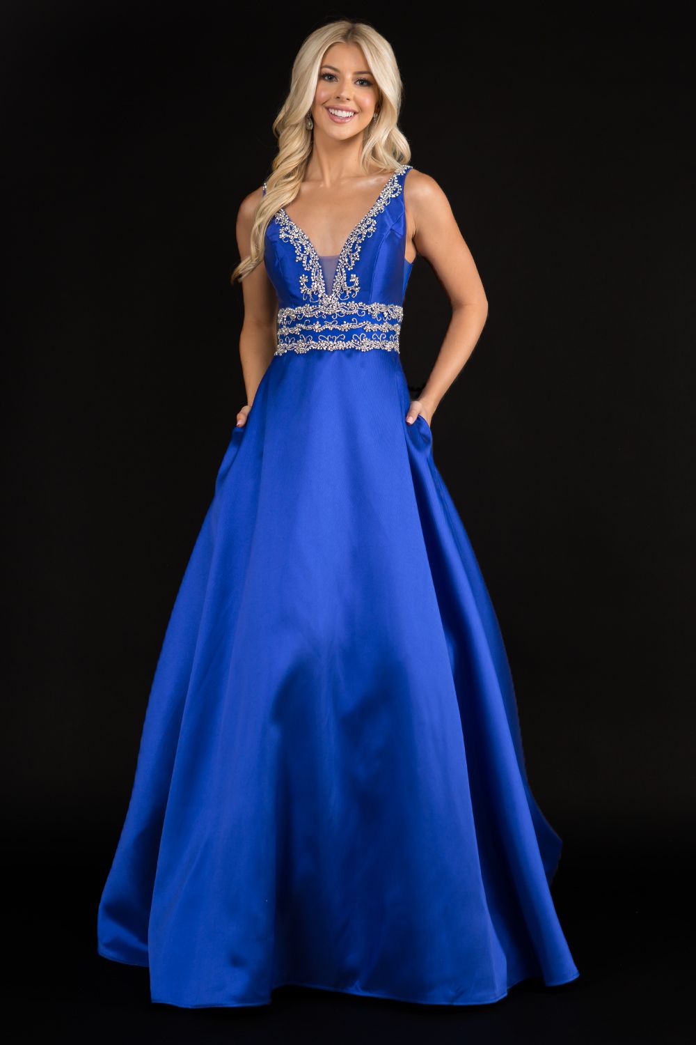 Nina Canacci 2290 Embellished plunging neckline A line prom dress embellished evening gown.  Three rows of embellishments around the waistline.  Colors:  Baby Blue, Ivory, Royal   Sizes:  8,10,12,14,16,18,20,22,24,