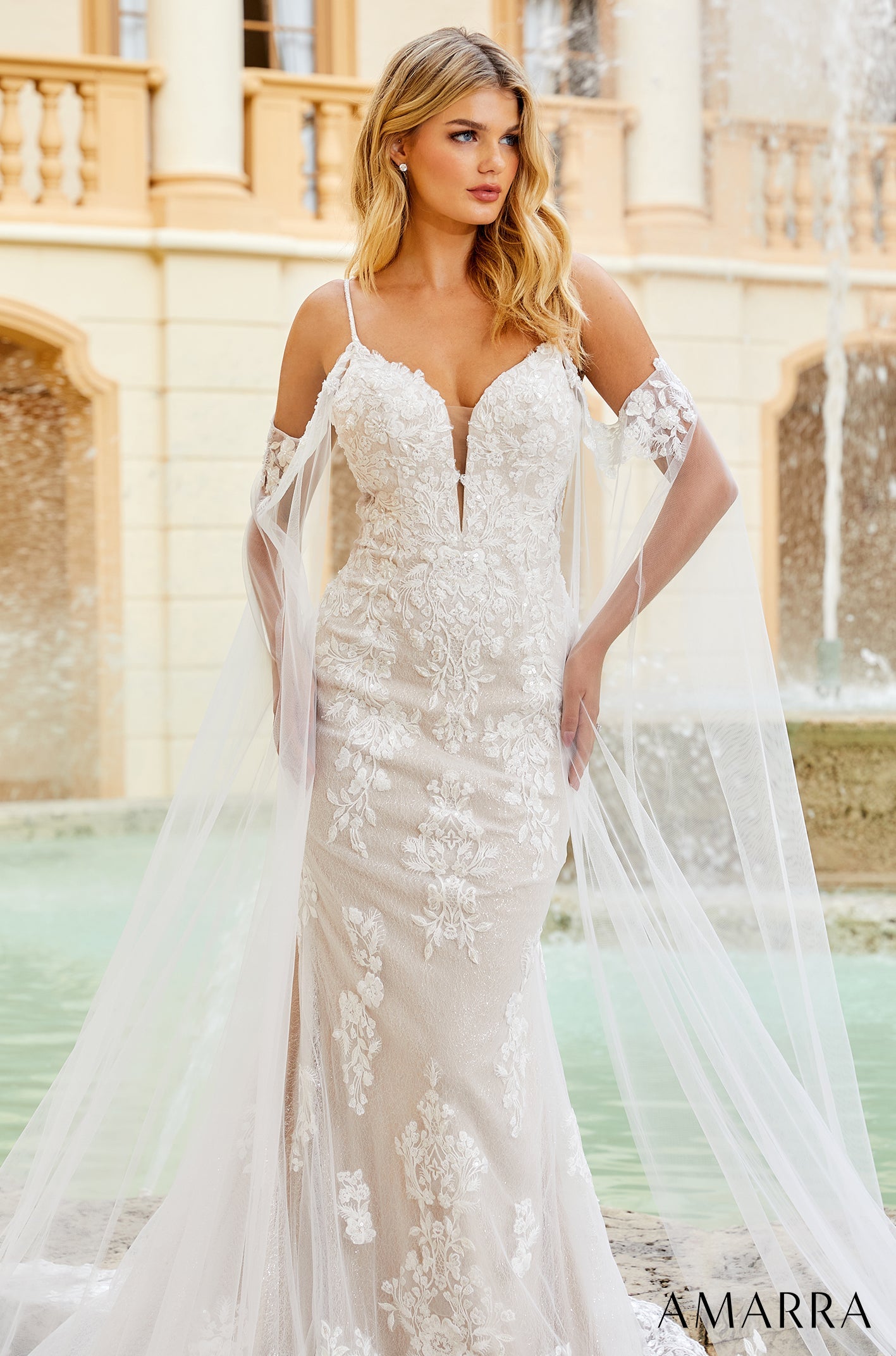 Amarra ELIZABETH 84377 Sequin Lace Fitted Wedding Dress Cape Sleeve Bridal off the shoulder Live out the wedding of your dreams in this classic, elegant gown. Adorned in intricate floral lace appliques, this wedding dress is bound to have you looking and feeling beautiful on your special day.