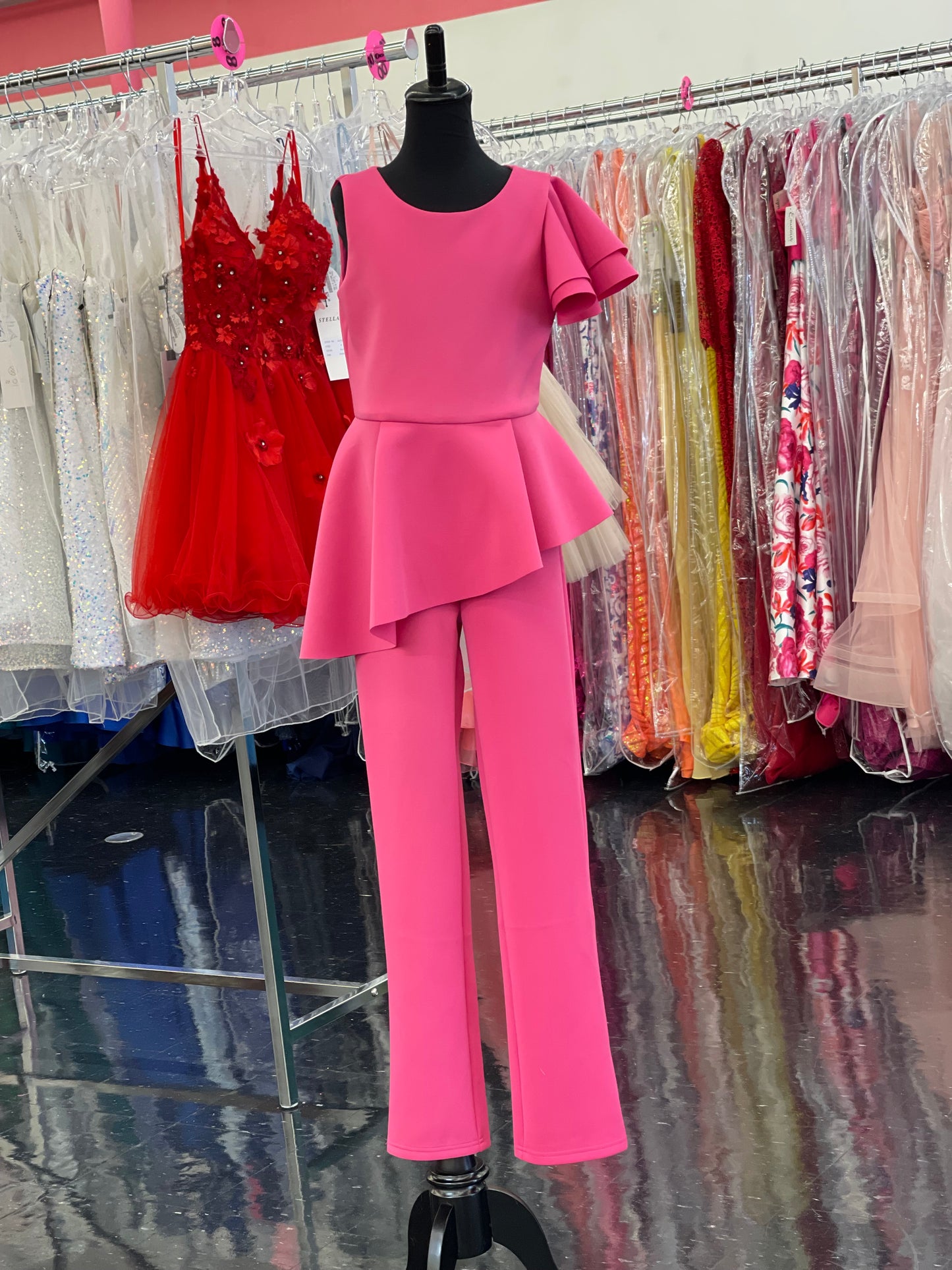 Marc Defang 8117k girls, kids pageant interview jumpsuit peplum skirt with one shoulder ruffle  Available sizes: 2-14  Available colors: Mint, Hot Pink, Red, Lilac (Check swatches for custom colors - 30-45 days)