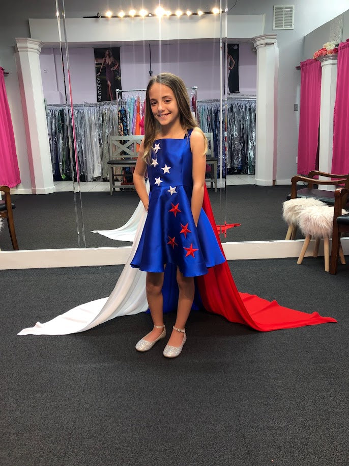 Marc Defang 5030 Red White & Blue Girls Pageant Fun Fashion Cape Detachable chiffon skirt/cape. Stars adorn he short a line dress. Perfect for Fun Fashion!  Available Sizes: 4-14  Colors: Red/White/Blue