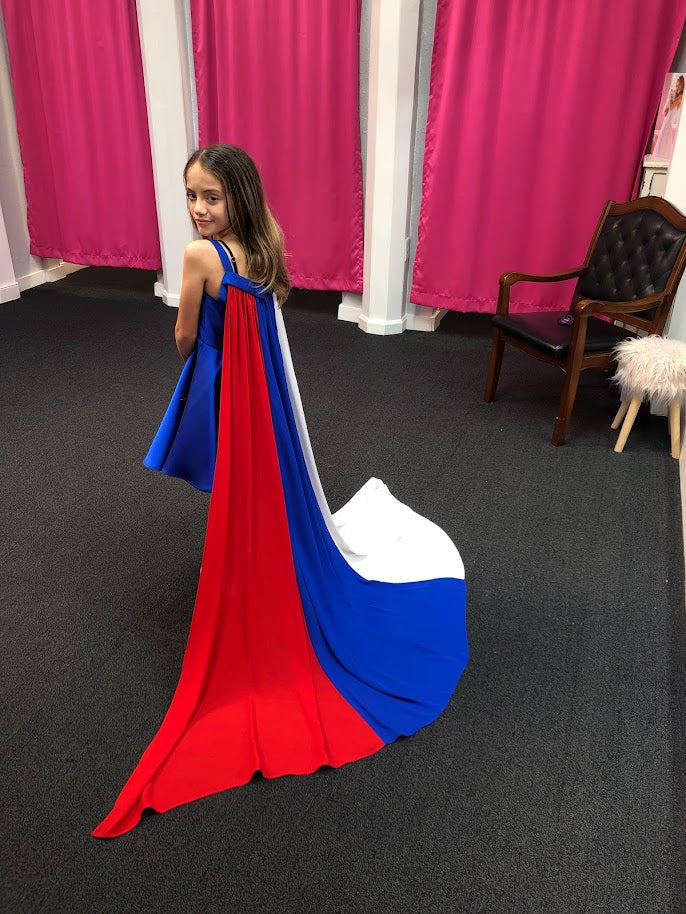 Marc Defang 5030 Red White & Blue Girls Pageant Fun Fashion Cape Detachable chiffon skirt/cape. Stars adorn he short a line dress. Perfect for Fun Fashion!  Available Sizes: 4-14  Colors: Red/White/Blue