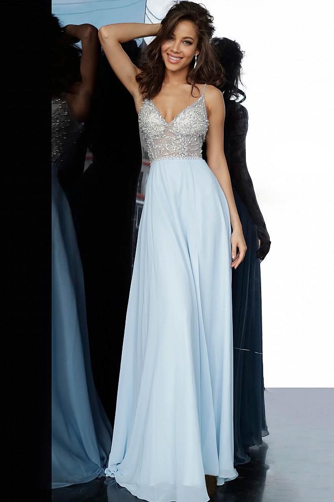 JVN4410 JVN 4410 is a long flowy pageant gown prom dress. Featuring a sheer embellished bodice and open back with with a V neckline and spaghetti straps. Flowing chiffon skirt with slit evening gown. 