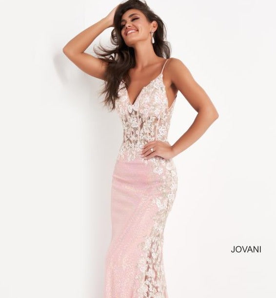 Jovani 06232 is a long fitted pink sequin Formal evening gown. Featuring a Gorgeous Sheer Corset Style fitted bodice with boning. V neckline. This Prom dress is accented with floral appliques embellished & Cascading from the bodice down into the sheer side panel that runs the length of this pageant gown. Backless. Sequin embellished skirt. Great sexy gown for any formal event!