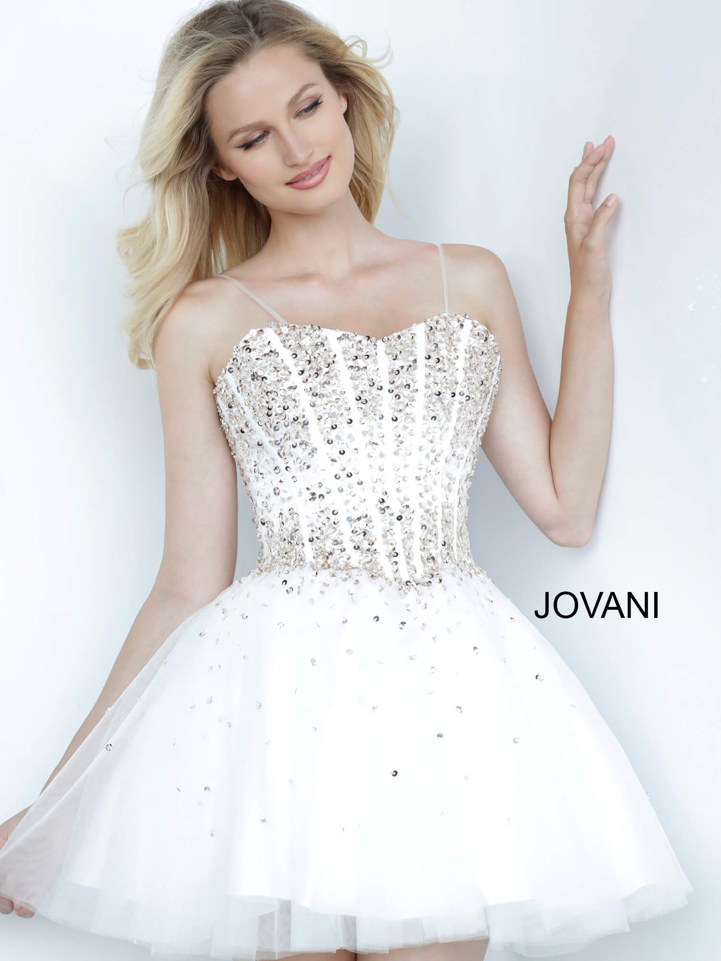 Jovani Kids k62533 is a Short Girls Prom Dress, Kids Pageant Gown & Pre Teen Formal Evening Wear gown. This Short Girls Fit & Flare Dress Features a sweetheart neckline with spaghetti straps. Embellished & Beaded Corset Bodice with boning. Embellishments cascade into the flared tulle skirt.  Available Girls Sizes: 8, 10, 12, 14  Available Colors: Black, Blue, Fuchsia, White