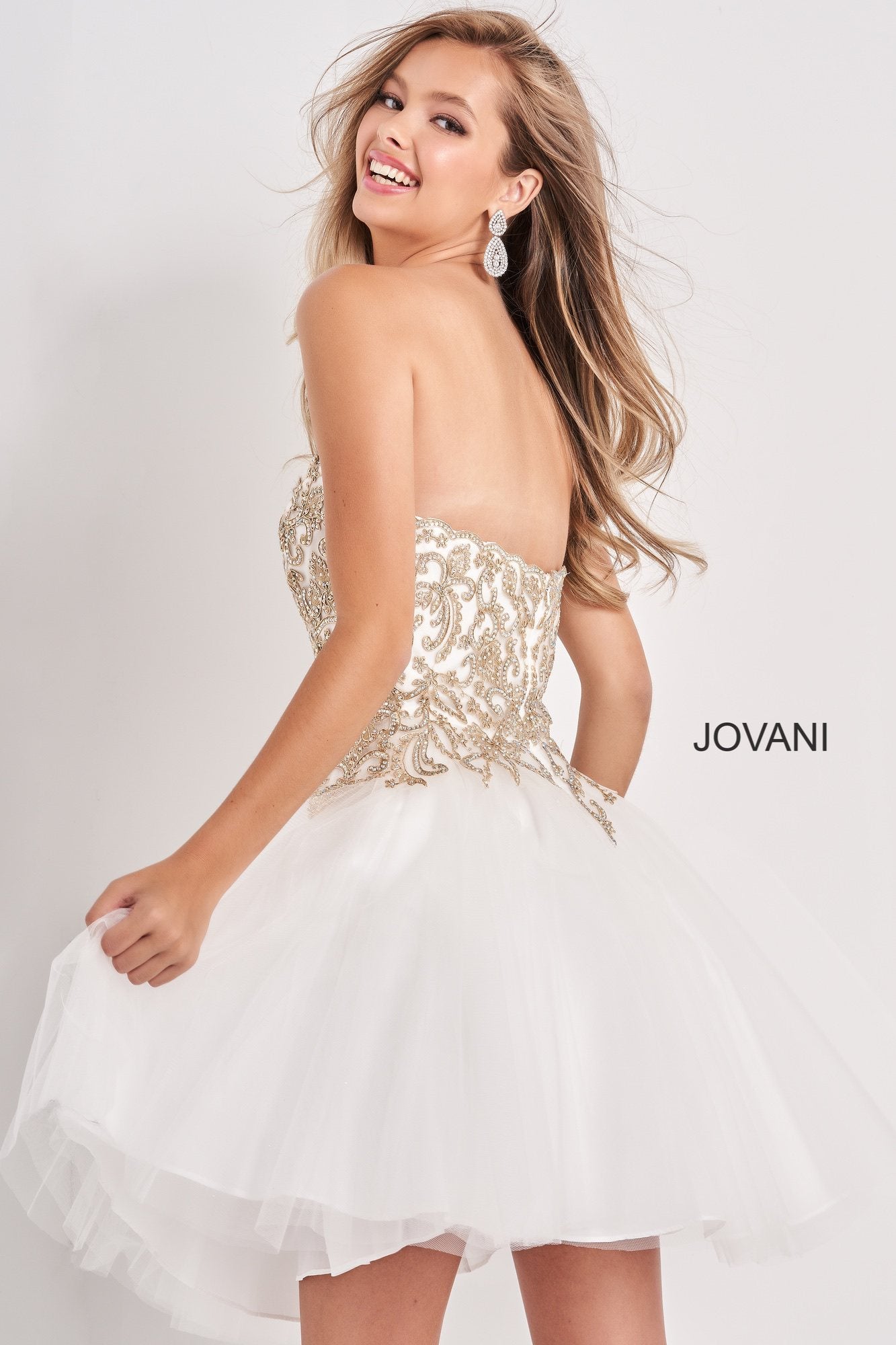 Jovani Kids k66720 is a Short Girls Party Dress, Kids Pageant Gown & Pre Teen Formal Evening Wear gown. This Strapless Straight neckline Girls Gown Features an Embellished Embroidered Applique for a stunning scallop Bedazzled Bodice with a classic look. Flared Tulle skirt.  Available Girls Sizes: 8, 10, 12, 14  Available Colors: Pale Pale Blue, White