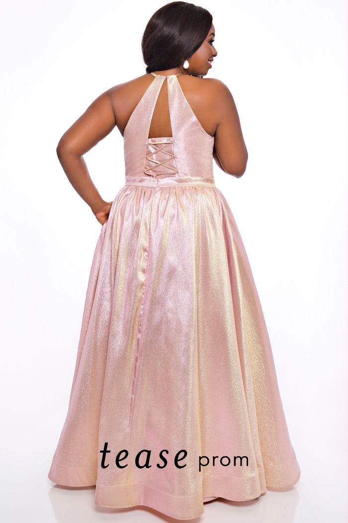 Tease Prom TE2019 high neckline shimmer prom dress ball gown.  Ramp up the glamour in this glimmering prom dress. The sleeveless halter neckline forms a dazzling deep V-bodice with a lace-up keyhole back. The unique two-tone satin shimmer fabric will be the talk of the town.  Full A-line skirt with pockets finishes off this vibrant prom or special event dress.  Time to shine in Cotton Candy, Ice Blue or Peacock.