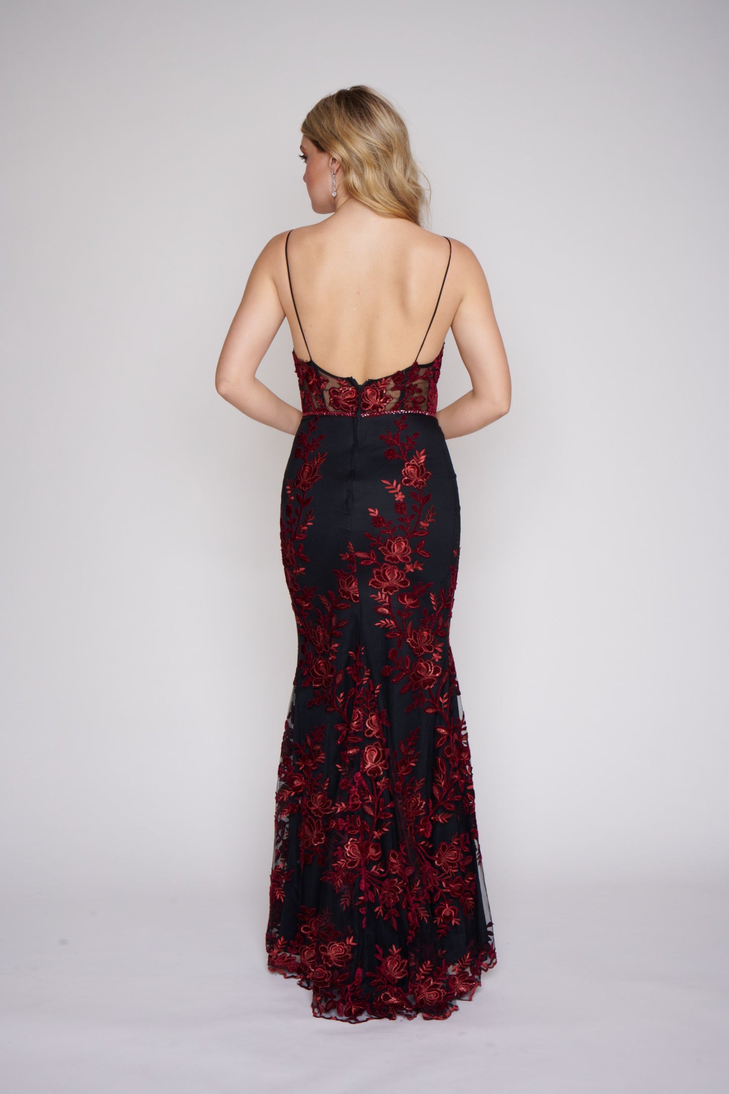 Nina Canacci 2240 Black Burgundy Long Prom Dress Fitted Evening Gown Floral Lace Dress This dress has a v neckline with sheer courtesy panel and a sheer lace back.  It is fully appliqued with Burgundy lace.  The fit and flare design is gorgeous on you and it has a matching embellished belt. 