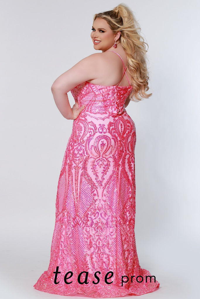 Tease Prom TE2205 Long Fitted Sequin Plus Size Prom Dress Formal Gown Corset  Colors: Flamingo, Lavender Size Availability: 14-24 Fitted & flare silhouette V-neckline, nude mesh insert Natural waistline Lace-up back with modesty panel  ¼ inch straps that go into the lace-up back for easy adjustment Multi-dimensional sequins on net Satin lace up ties 5 inch sweep train Horsehair hem Stretch knit lining