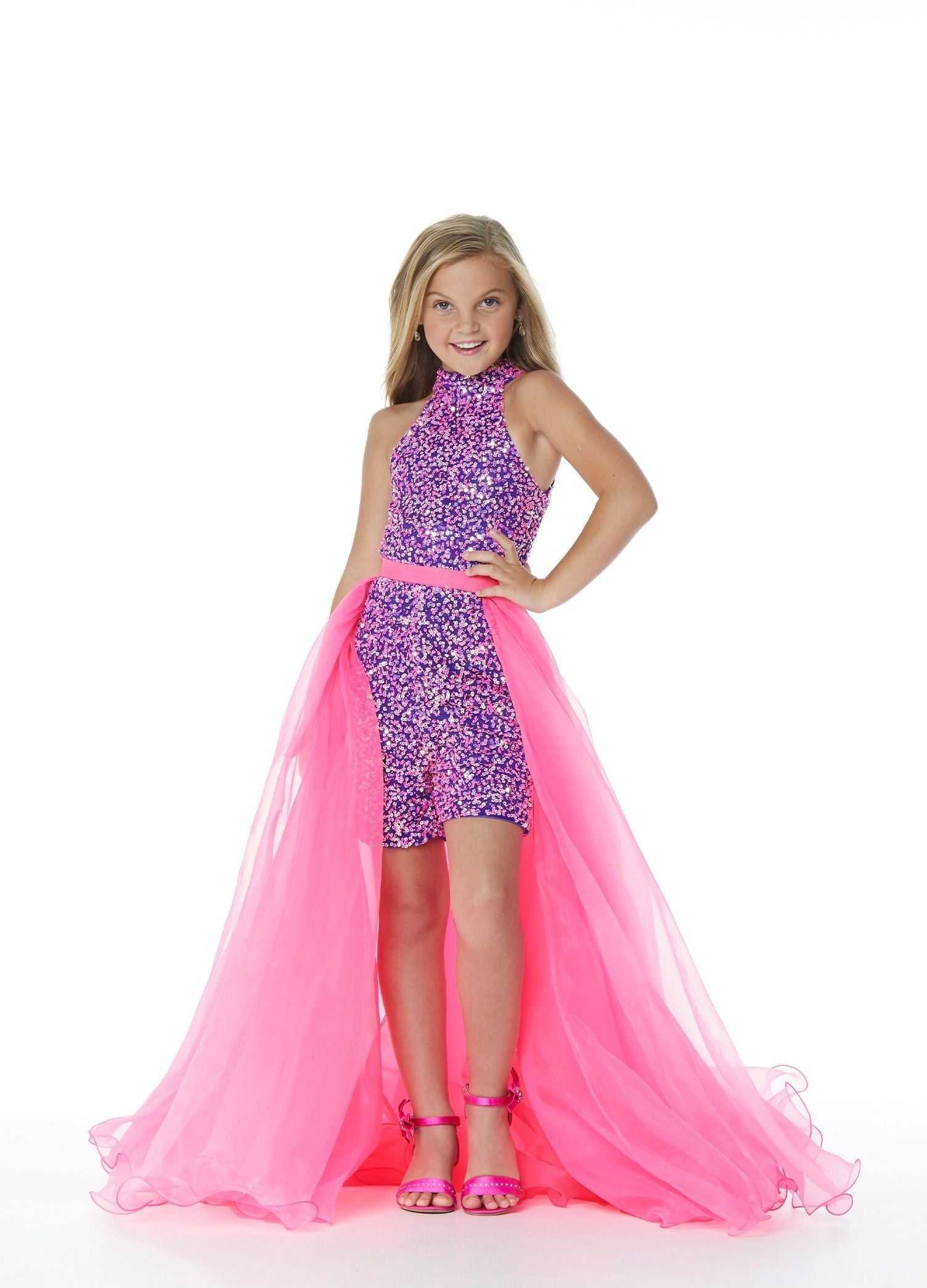 Ashley Lauren 8067 Pair this kids organza overskirt with wire hem with your favorite ASHLEYlauren jumpsuit, romper or cocktail dress.  Colors Hot Pink, Ivory, Fuchsia, Lilac, Pink, Royal, Sky  Sizes  4, 6, 8, 10, 12, 14  Wire Hem Organza Pictured Here with Jumpsuit Style 8069