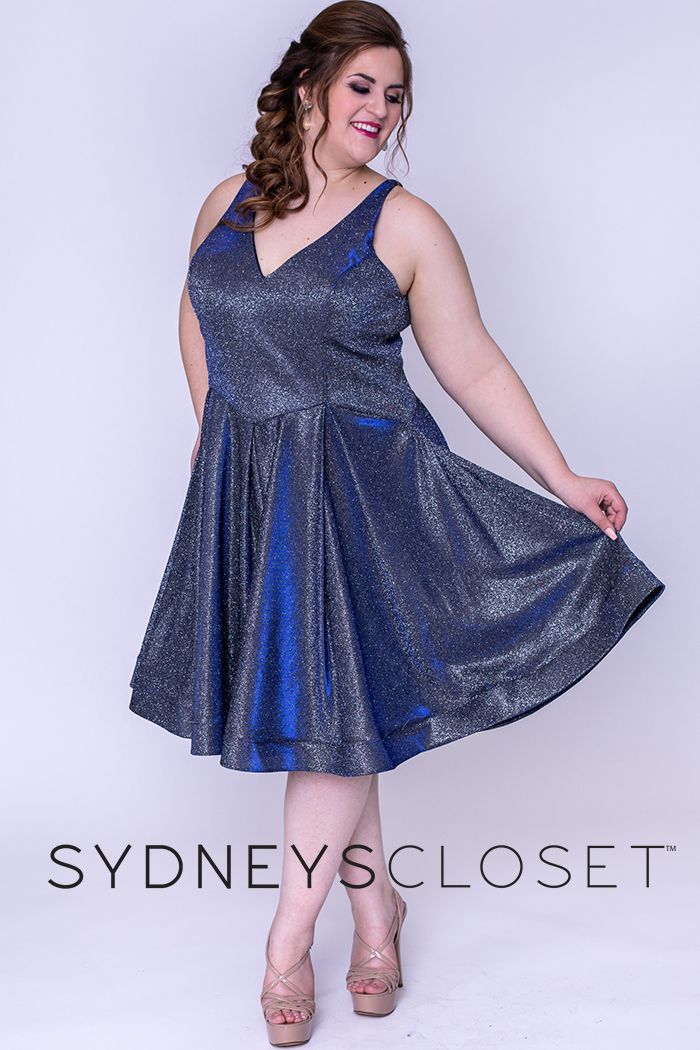 Sydney's Closet 8100 This is a super trendy plus sized V neckline holographic short formal cocktail dress that is knee length.  This short prom dress has wide straps and is bra friendly.  The homecoming dress has a basque waistline and pleated skirt with horsehair trim.  Colors  Cosmic Cobalt, Sonic Silver  Sizes  14, 16, 18, 20, 22, 24, 26, 28, 30, 32