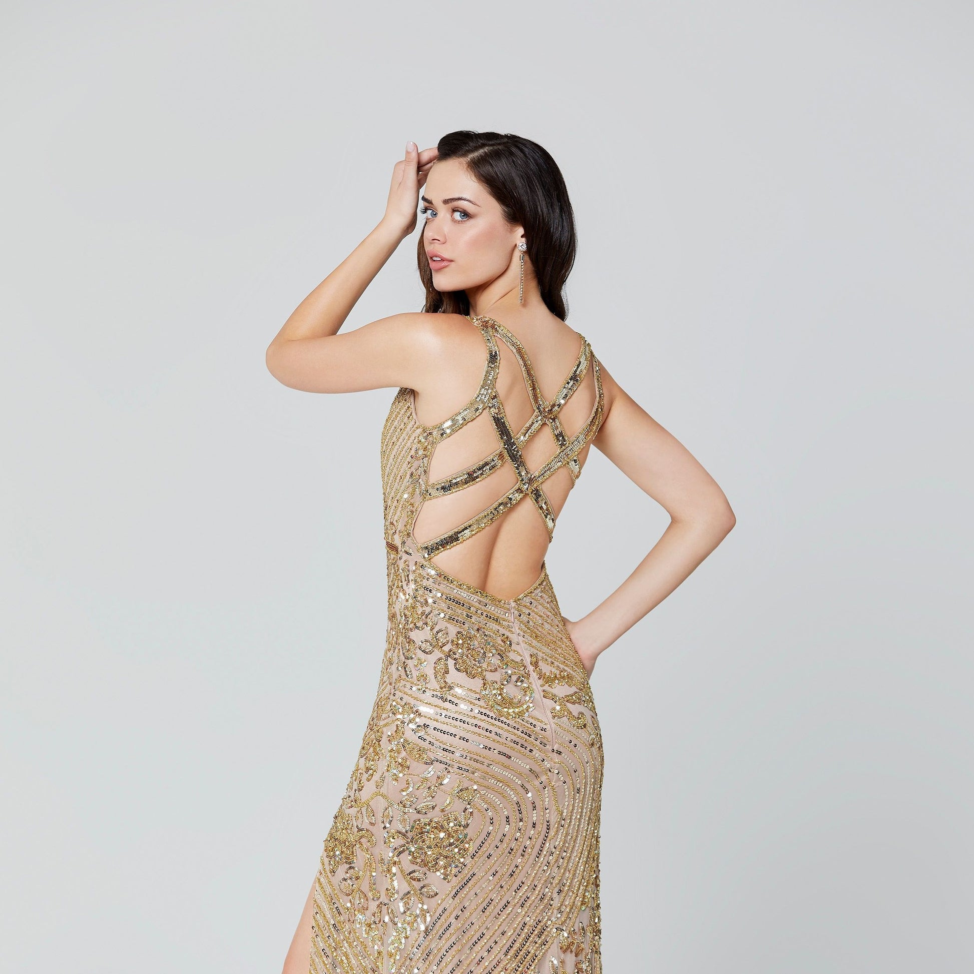 Primavera Couture 3412 v neckline sequin beaded evening gown with beaded belt waistline and side slit.  This prom dress features multiple straps that cross in the open back. Great for prom or pageant. 