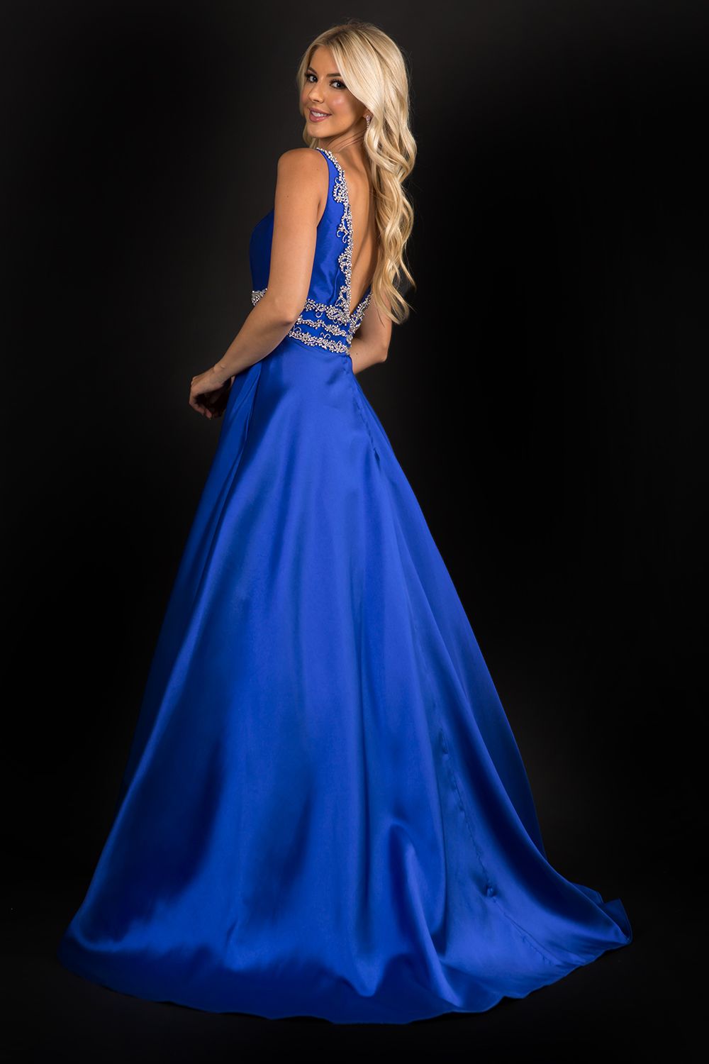 Nina Canacci 2290 Embellished plunging neckline A line prom dress embellished evening gown.  Three rows of embellishments around the waistline.  Colors:  Baby Blue, Ivory, Royal   Sizes:  8,10,12,14,16,18,20,22,24,