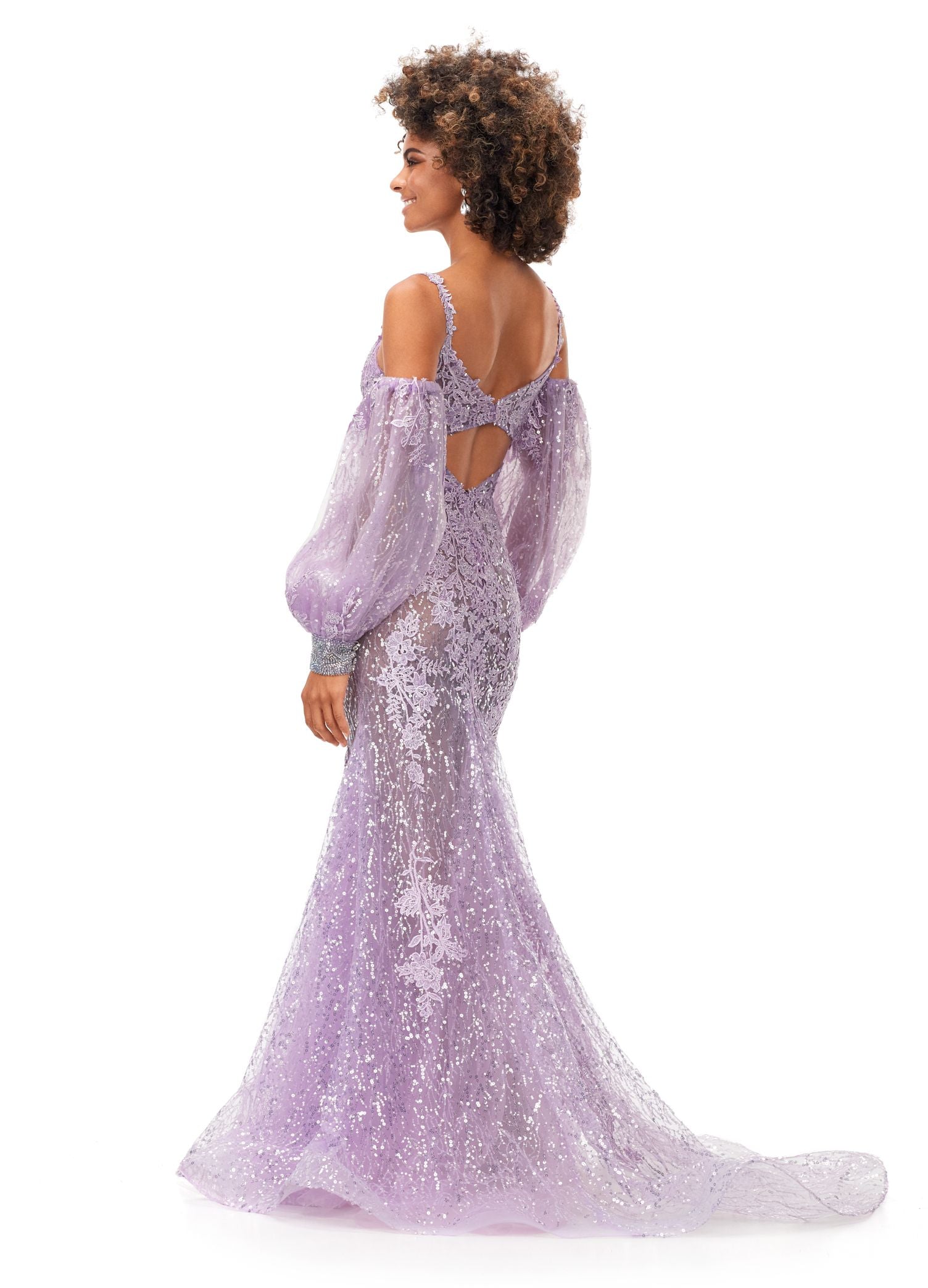 Ashley Lauren 11335 This stunning spaghetti strap sequin applique gown with appliques features an illusion corset bodice. The look is complete with a trumpet skirt and detachable puff sleeves. Spaghetti Straps Open Back Detachable Puff Sleeves Sequin Applique COLORS: Lilac, Sky