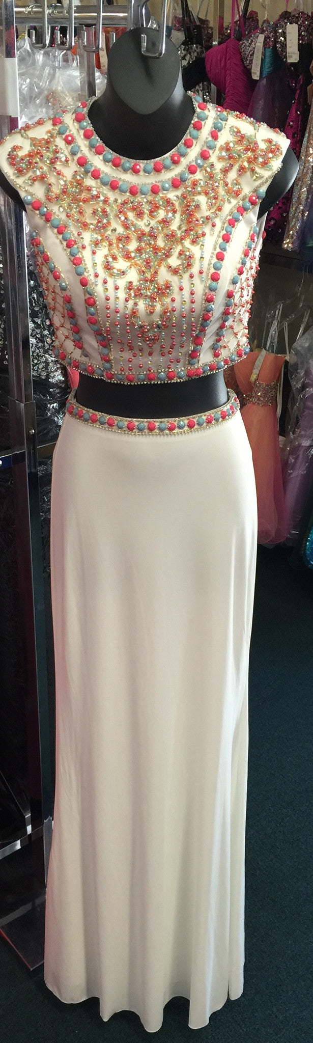 JVN by Jovani style JVN34015 Sexy two piece prom dress features sleeveless multicolored coral and mint beaded top with cutout back and a fitted jersey skirt. Two Piece Beaded Prom Dress High Neck Formal Gown JVN 34015  Available Size: 0  Available Color: White