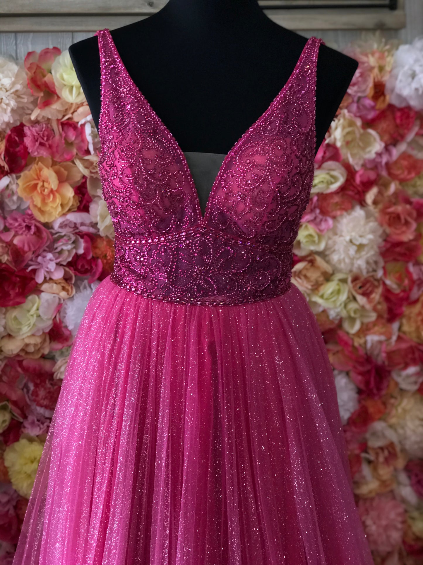 Jovani JVN05818 - JVN 05818 is a Gorgeous Long Glittering Tulle A Line ballgown prom dress. Featuring a sheer Fitted V Neckline bodice with crystal rhinestone embellishments. Open V Back. Look like a princess in this stunning formal evening gown.  Fuchsia size 8  Available Sizes: 00,0,2,4,6,8,10,12,14,16,18,20,22,24  Available Colors: Blush, Fuchsia, Light Blue