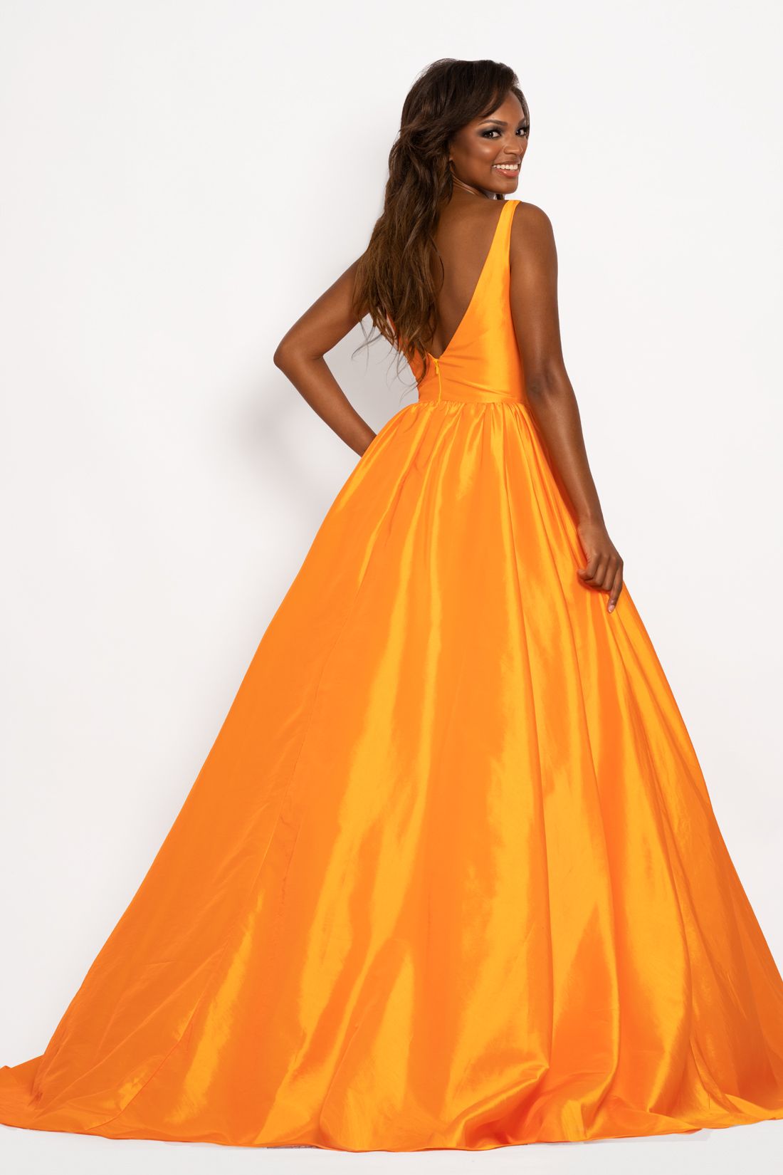 Johnathan Kayne 2225 Major Cinderella Vibes in this shimmery taffeta long A line prom dress.  This pageant gown features a plunging sweetheart neckline with mesh panel and v back.   Colors:  Bubblegum, Mandarin  Sizes  00, 0, 2, 4, 6, 8, 10, 12, 14, 16