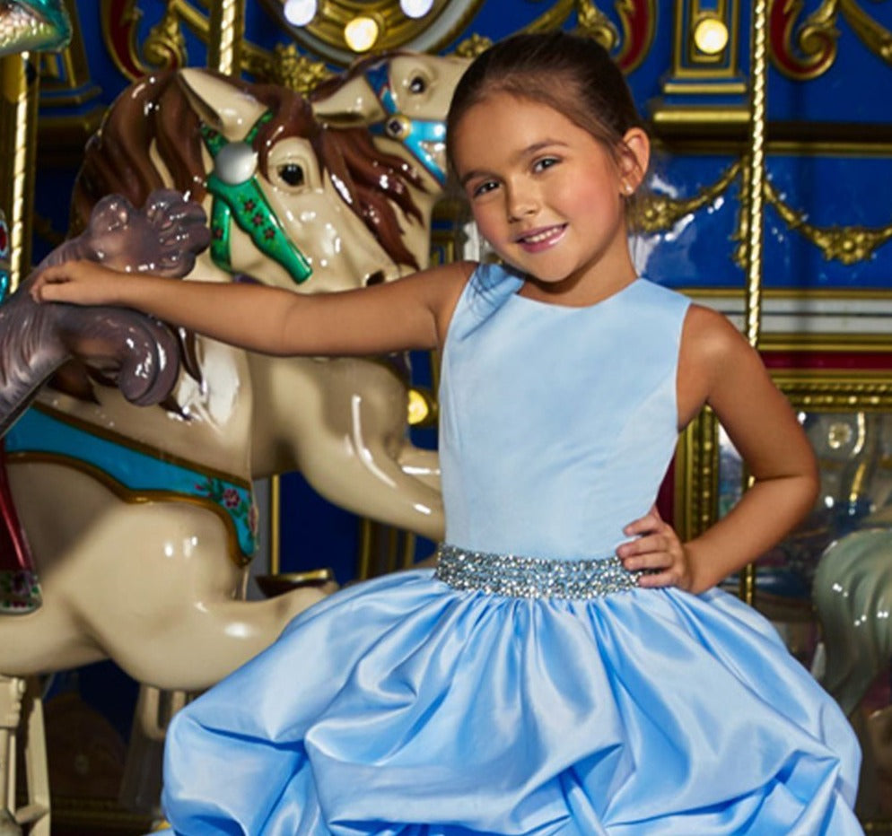 Ashley Lauren 8036 The perfect princess dress is here! This girls and preteens crew neckline pageant gown features a crystal belt at the waist and a full pick-up ball gown skirt.  Colors Ivory, Sky  Sizes  2, 4, 6, 8, 10, 12, 14   A-Line Crystal Beaded Belt Crew Neckline Pickup Skirt