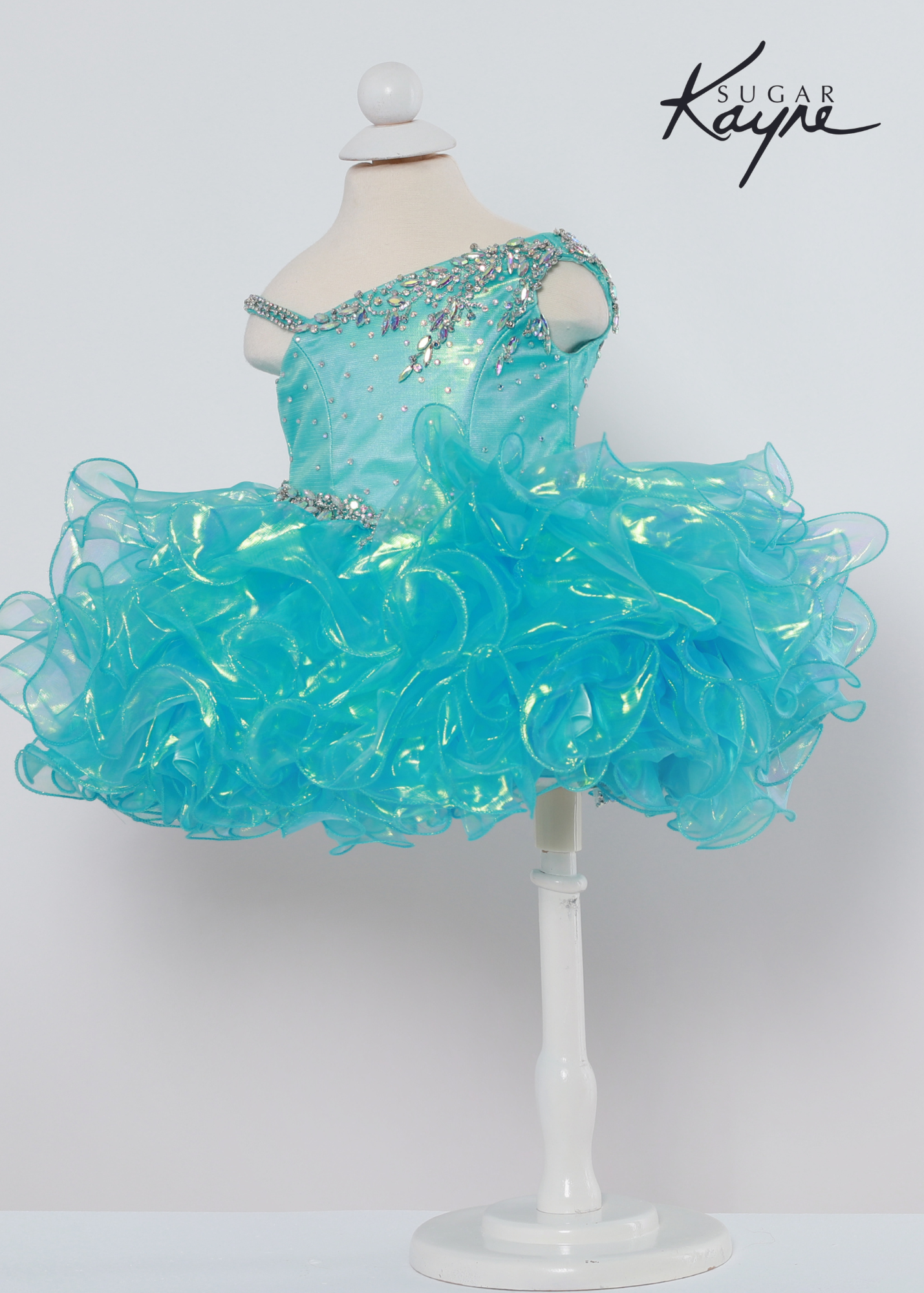 Sugar Kayne C214 iridescent organza gown with a corset back  Available sizes: 0M,6M,12M,18M,24M,2T,3T,4T,5T,6T  Available Colors: Aqua, Lemon Lime, Pink