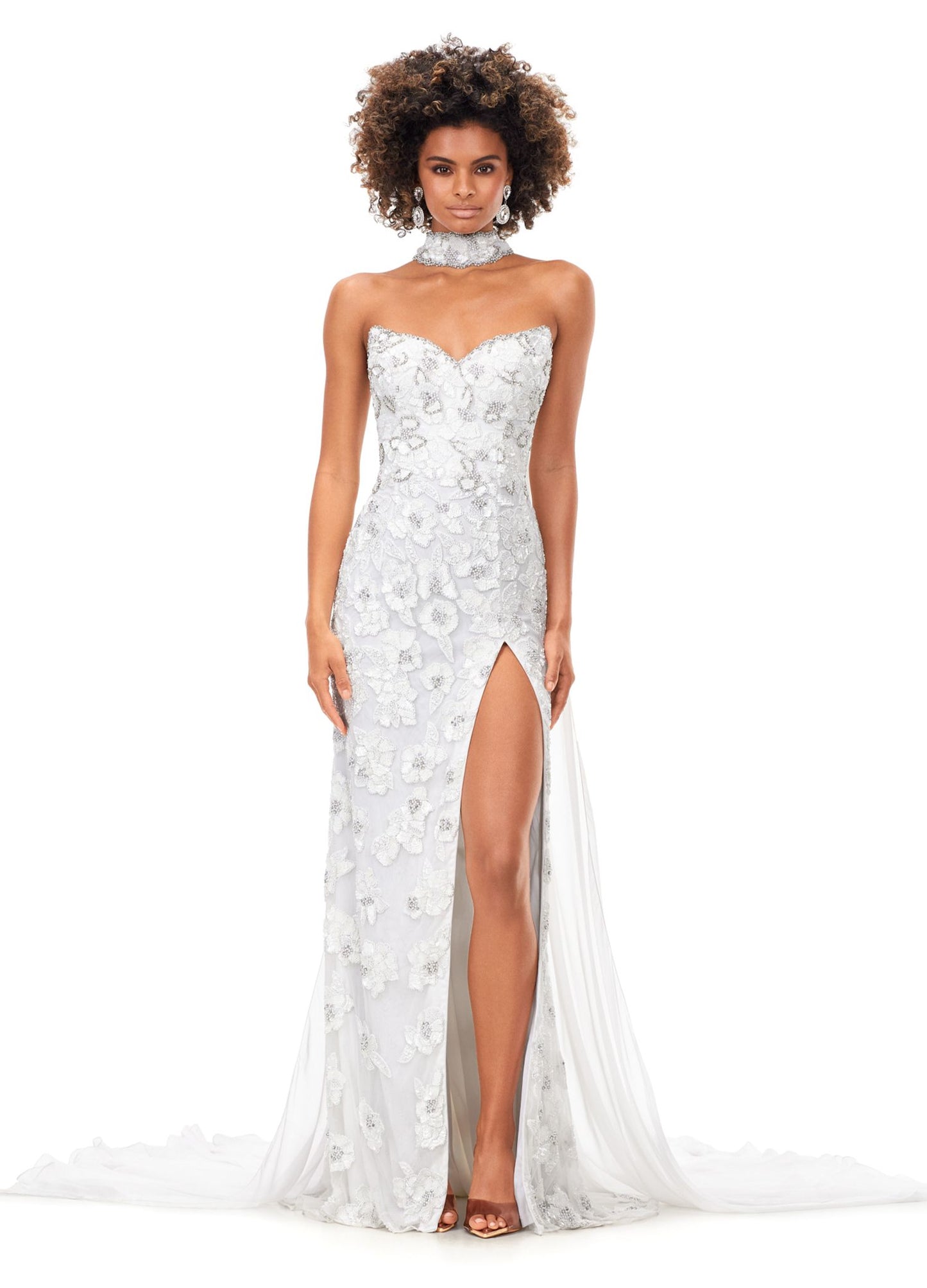 Ashley Lauren 11351 All we can say is WOW! This strapless beaded gown with crystal detailing is sure to make a statement at your next event. The gown features a gorgeous beaded neck choker with attached chiffon cape. Strapless Gown Beaded Choker Chiffon Cape Left Leg Slit COLORS: Royal, Ivory, Red, Neon Pink